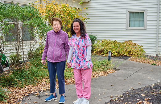 nursing accompanying a woman on an outside walk