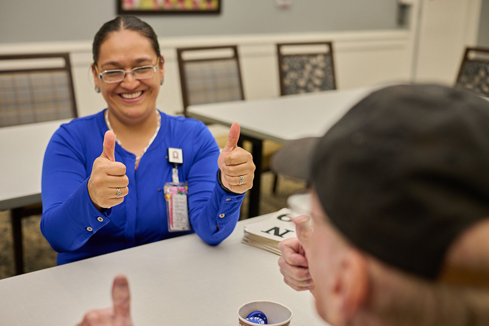 Memory-Care-2026 Nursing giving a resident a thumbs up